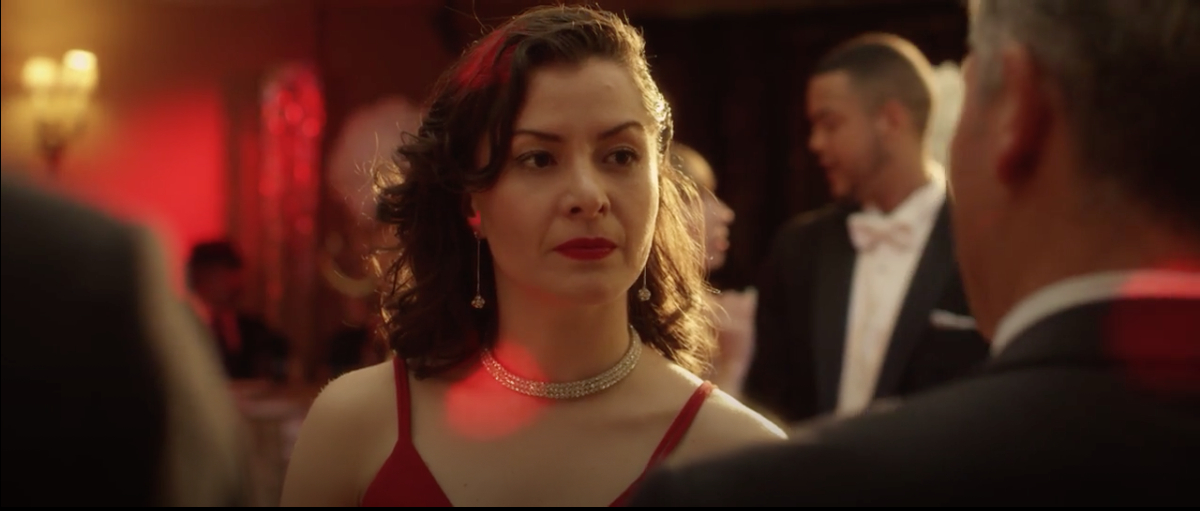 Wendy Lechuga in red dress — scene from "La Santera" short film