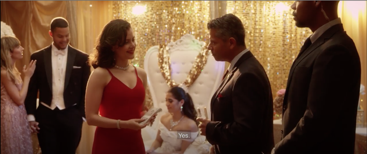 Wendy Lechuga in red dress at quinceañera scene — "La Santera" short film