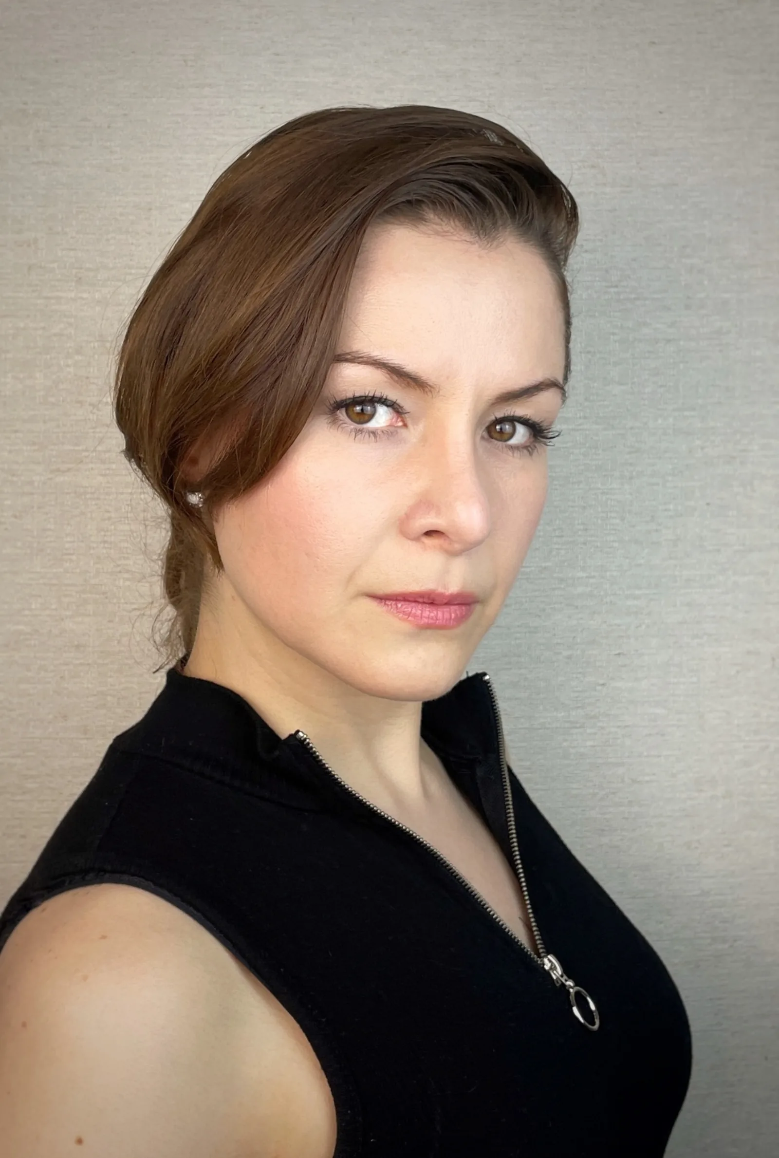 Wendy Lechuga close-up portrait in black sleeveless top — strong, contemporary leading-lady look